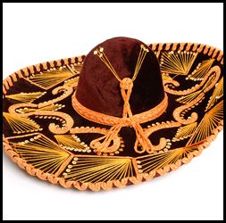 Sombrero de charro adornado color café y jaripeo naranja.